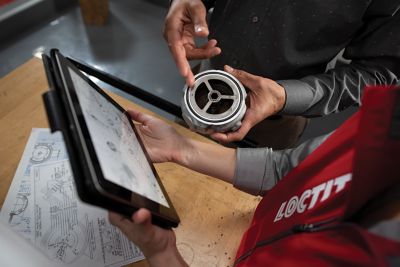Photo of laptop, tablet and mobile phone with illustration of same web design on screen of all three devices